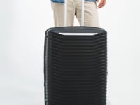 Valise rigide légère et extensible Samsonite Upscape 68 cm Spinner noire de taille moyenne, capacité de rangement de 15 à 20 kg